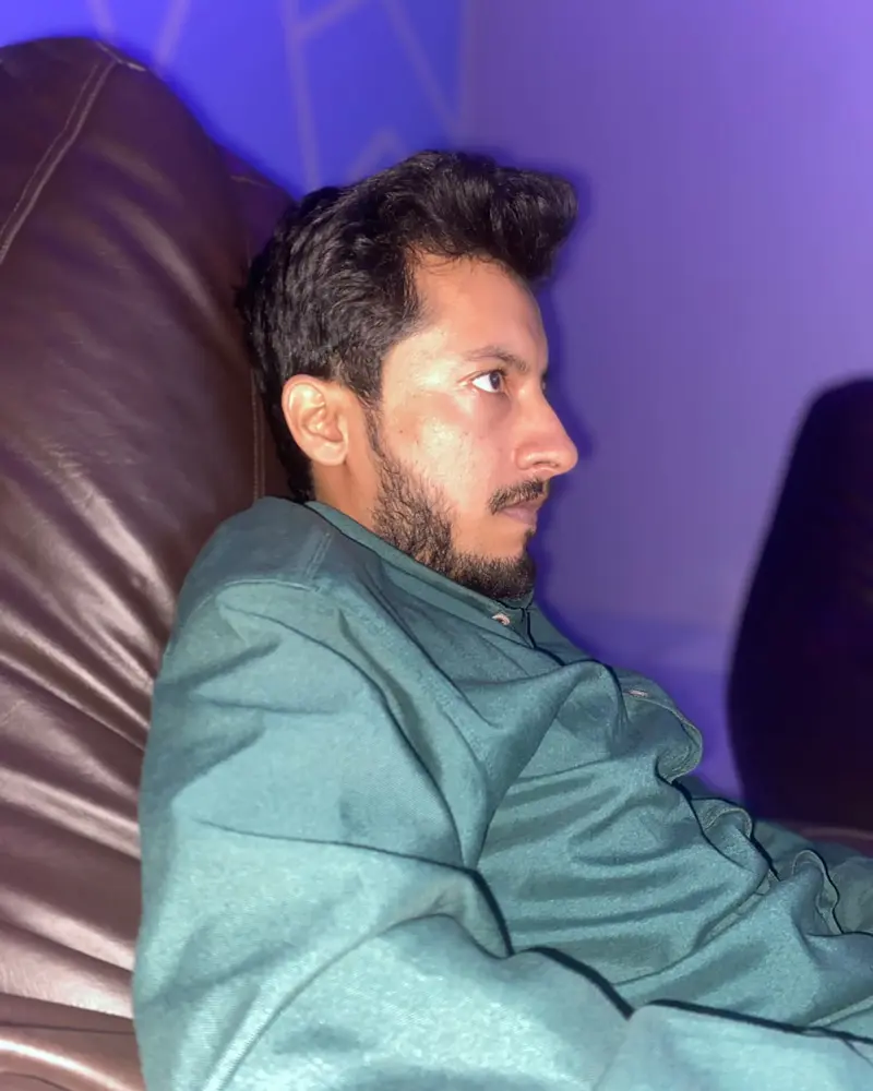 A player on a bean bag watching the screen at ARISE